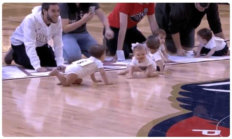 బేబీ క్రాలింగ్ రేస్.. వైరల్ వీడియో! | Video of baby race during nba ...