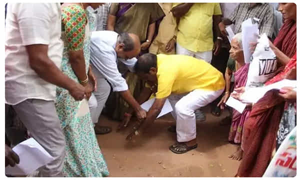 తహసీల్దార్ కాళ్లకు మొక్కిన టీడీపీ ఎమ్మెల్యే...ఎందుకంటే..?