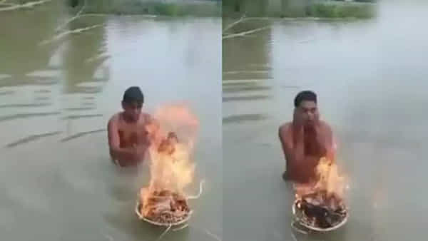 Viral Video: ఇదేందిది.. చలి కాచుకుంటూ నదిలో స్నానం.. ఫన్నీ వీడియో ట్రెండింగ్..