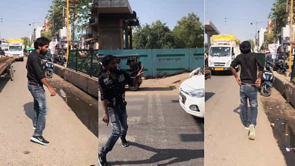Viral Video: రోడ్డు దాటడానికి యువకుడు అద్భుతమైన ట్రిక్.. చూస్తే నవ్వకుండా ఉండలేరు..