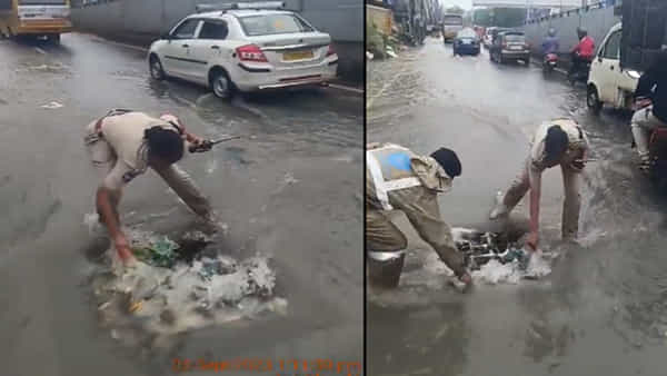Hyderabad: భారీ వర్షానికి మ్యాన్హోల్ వద్ద నిలిచిపోయిన చెత్త .. స్వయంగా క్లీన్ చేసిన ట్రాఫిక్ పోలీసులు.. సర్వత్రా ప్రశంసల వర్షం..