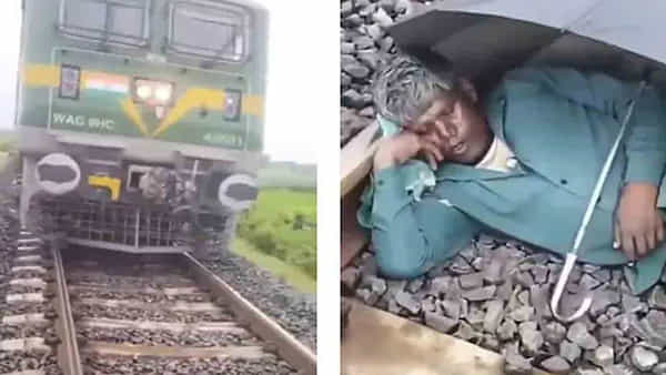 Watch: ఏం పెద్దమనిషివయ్యా..! ఎక్కడా చోటు లేన్నట్టు గొడుగు అడ్డుపెట్టుకుని మరీ రైలు పట్టాలపై ఇలాగేనా..?