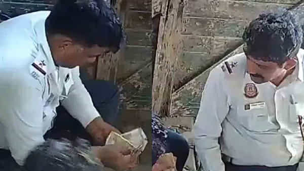 Watch: వారెవ్వా..ట్రాఫిక్ పోలీసుల మజాకా..! లంచం డబ్బులు దర్జాగా కూర్చొని పంచుకుంటున్నారు..