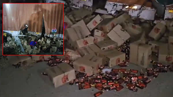 Liquor Container: ఫుల్లోడ్ మద్యంతో వెళ్తున్న లారీ రోడ్డుపై బోల్తా.. కోట్ల రూపాయల సరుకు సెకన్లలో ఎత్తుకుపోయిన జనాలు