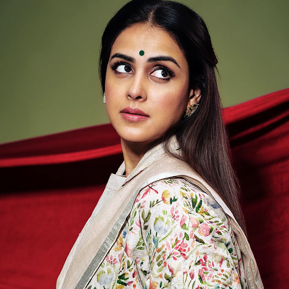 ఇక తెలుగులో సత్యం , సై , బొమ్మరిల్లు , ఢీ, రెడీ , కథ వంటి చిత్రాలతో తెలుగు ప్రేక్షకులకు దగ్గరయింది. ముఖ్యంగా బొమ్మరిల్లు చిత్రంలో ఆమె నటనకు ఫిల్మ్ఫేర్ అవార్డు (ఉత్తమ నటి - తెలుగు) లభించింది. తెలుగు ప్రేక్షకుల మనసులో స్థానం సంపాధించుకుంది.