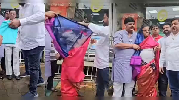కాంగ్రెస్ నేతకు చీర కట్టించిన బీజేపీ కార్యకర్తలు.. ఎందుకో తెలుసా?