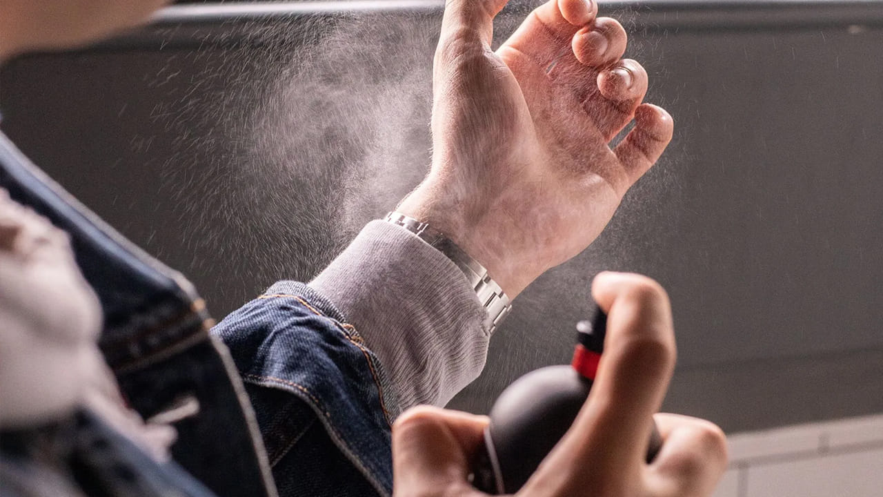 Spraying Perfume On Palm