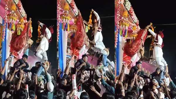 Viral Wedding Video: ఇది పెళ్లా లేక ఉట్టి కొట్టే పోటీలా? గాలిలో తేలుతూ వధూవరుల వరమాల.. నెటిజన్లు షాక్!
