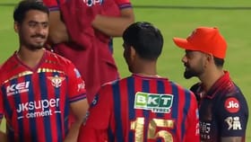 కోహ్లీ కాళ్లు మొక్కిన లక్నో కుర్రాడు.. కింగ్ రియాక్షన్ వైరల్