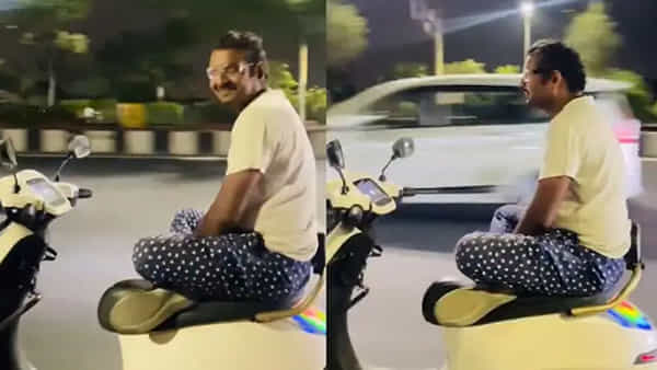 నడి రోడ్డుపై యోగా స్టంట్.. చేతులు, కాళ్లు ముడుచుకుని స్కూటర్ నడిపిన కేటుగాడు.. వీడియో వైరల్!