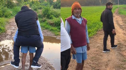 వృద్ధుడి వీపుపై ఎక్కి కాలువ దాటిన పట్వారీ..!