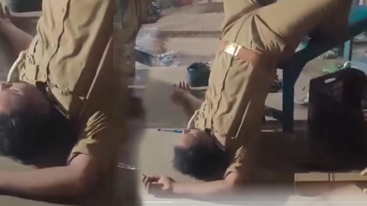 కాళ్లు పైకి, మొండెం కిందికి కుర్చీపై తలకిందులుగా పోలీస్ అధికారి.. అసలు కారణం తెలిస్తే షాకవుతారు!